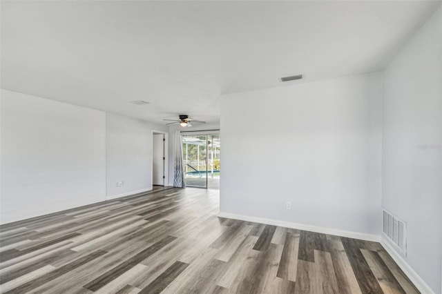 unfurnished room with ceiling fan and hardwood / wood-style floors