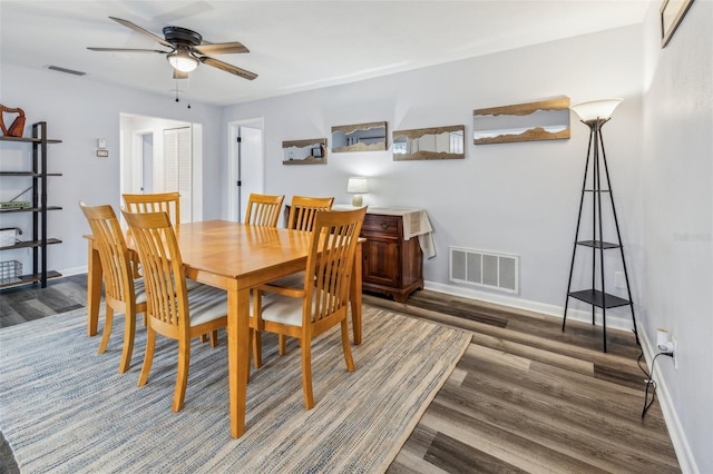 dining area with dark hardwood / wood-style flooring and ceiling fan