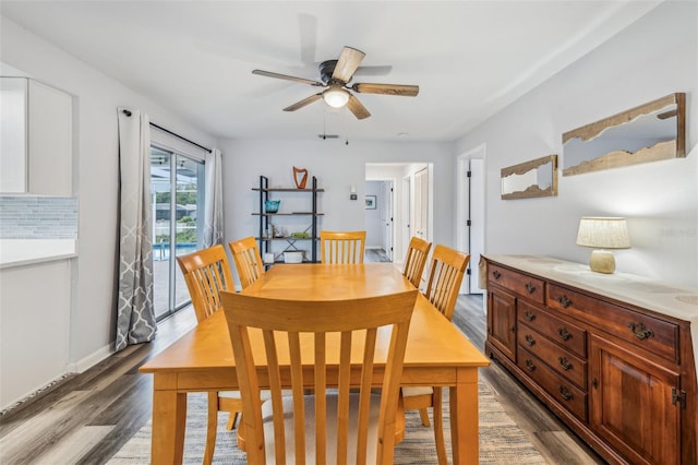 dining space featuring dark hardwood / wood-style floors and ceiling fan