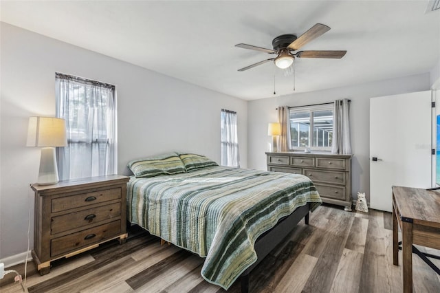 bedroom featuring ceiling fan and dark wood-type flooring