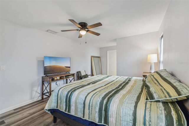 bedroom featuring hardwood / wood-style floors and ceiling fan