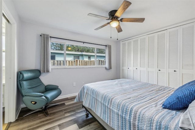 bedroom featuring hardwood / wood-style floors, a closet, and ceiling fan