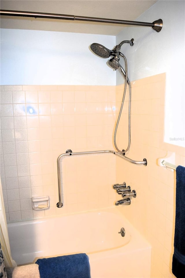 bathroom with shower / bath combination with curtain