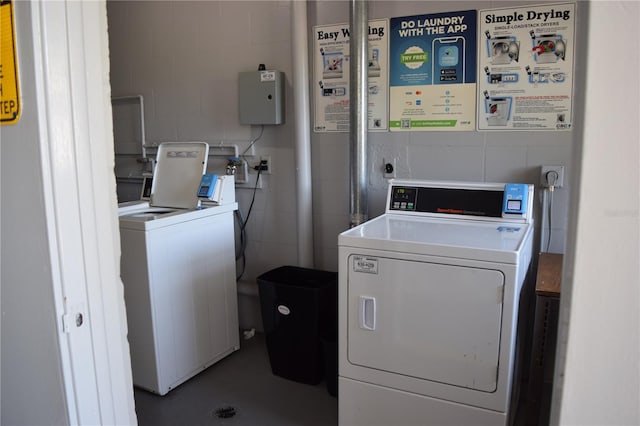 washroom featuring washer and clothes dryer