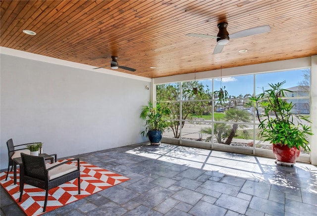 exterior space featuring ceiling fan