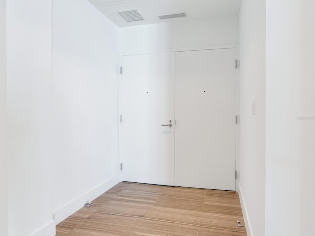 empty room with light hardwood / wood-style floors