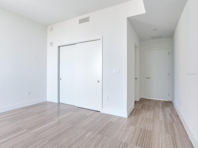 unfurnished bedroom featuring a closet