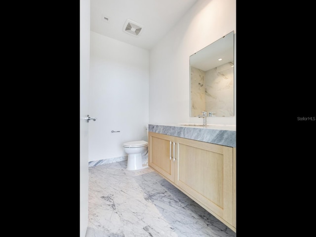 2912 W Santiago St Unit 2204, Tampa, FL 33629 - full bathroom with marble look tile flooring, toilet, vanity, a marble finish shower, and baseboards