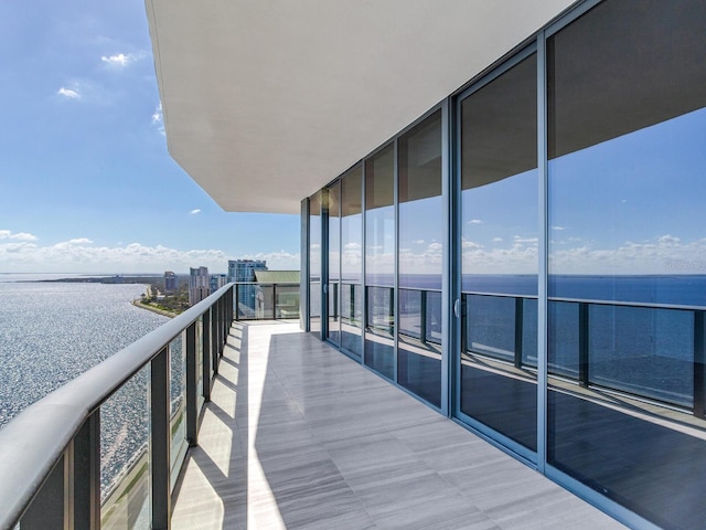 balcony featuring a water view