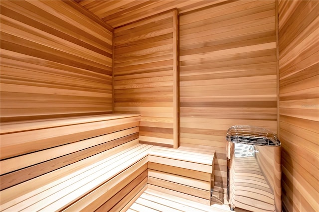 view of sauna / steam room featuring wooden walls