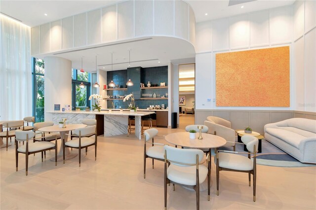 2912 W Santiago St Unit 2204, Tampa, FL 33629 - community lobby with a towering ceiling, a wainscoted wall, and a decorative wall
