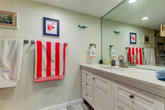 bathroom featuring vanity and wood-type flooring