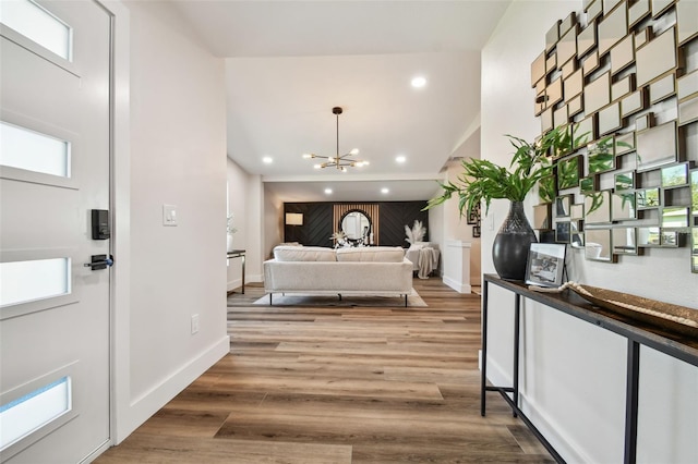 interior space with hardwood / wood-style floors and a notable chandelier