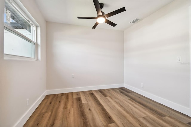 spare room featuring ceiling fan and hardwood / wood-style floors