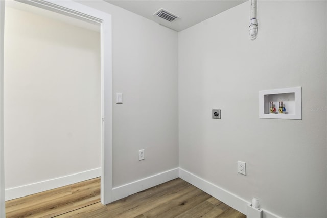 laundry room featuring washer hookup, hookup for an electric dryer, and hardwood / wood-style floors