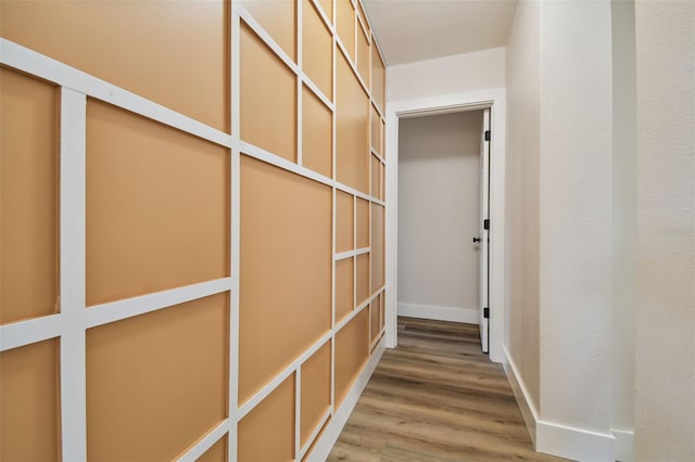 corridor featuring wood-type flooring