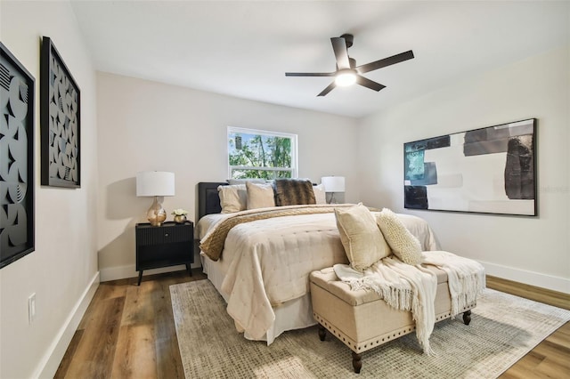 bedroom with hardwood / wood-style flooring and ceiling fan