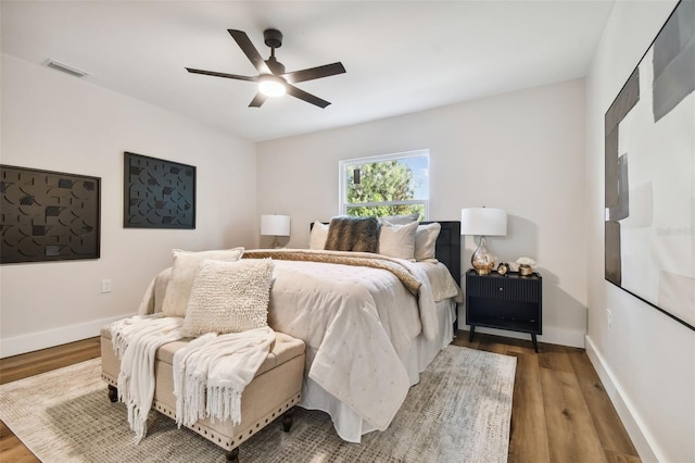 bedroom featuring hardwood / wood-style flooring and ceiling fan