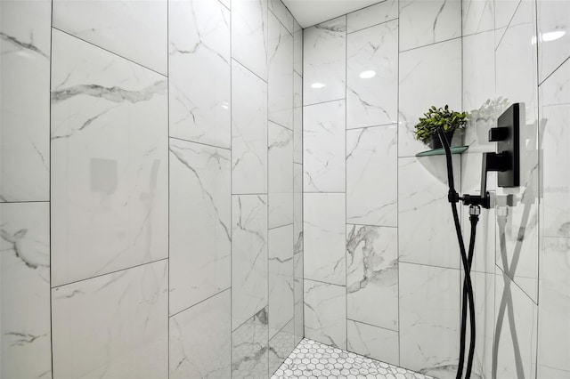 bathroom with a tile shower