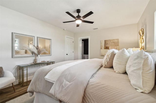 bedroom featuring hardwood / wood-style flooring and ceiling fan