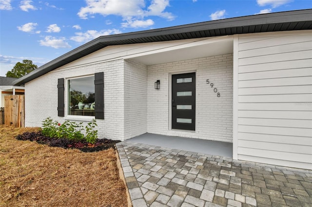 doorway to property with a patio area