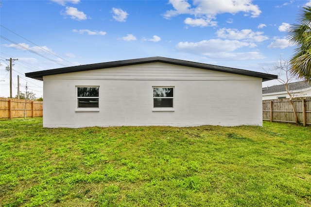 view of home's exterior with a lawn