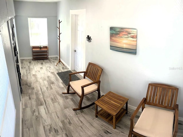 living area with light hardwood / wood-style flooring