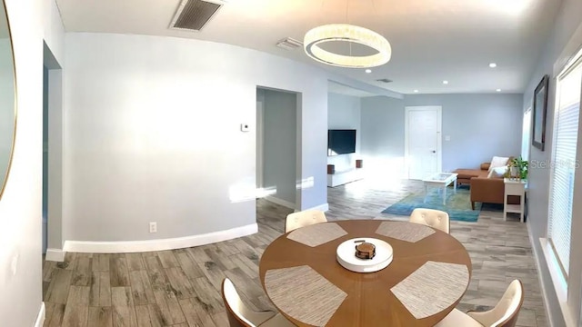 dining space with light wood-type flooring