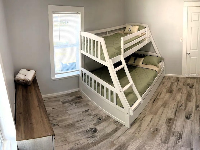 bedroom with wood-type flooring