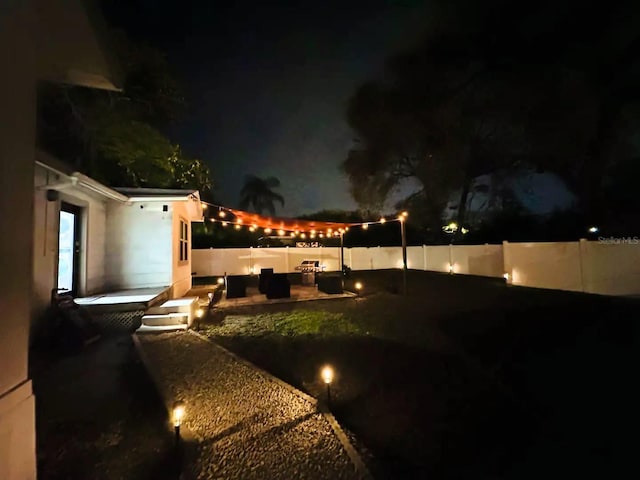 view of yard at night