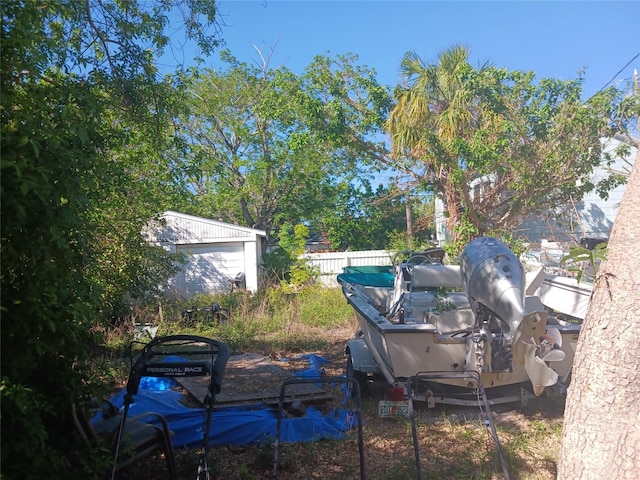 view of yard featuring an outbuilding and a garage