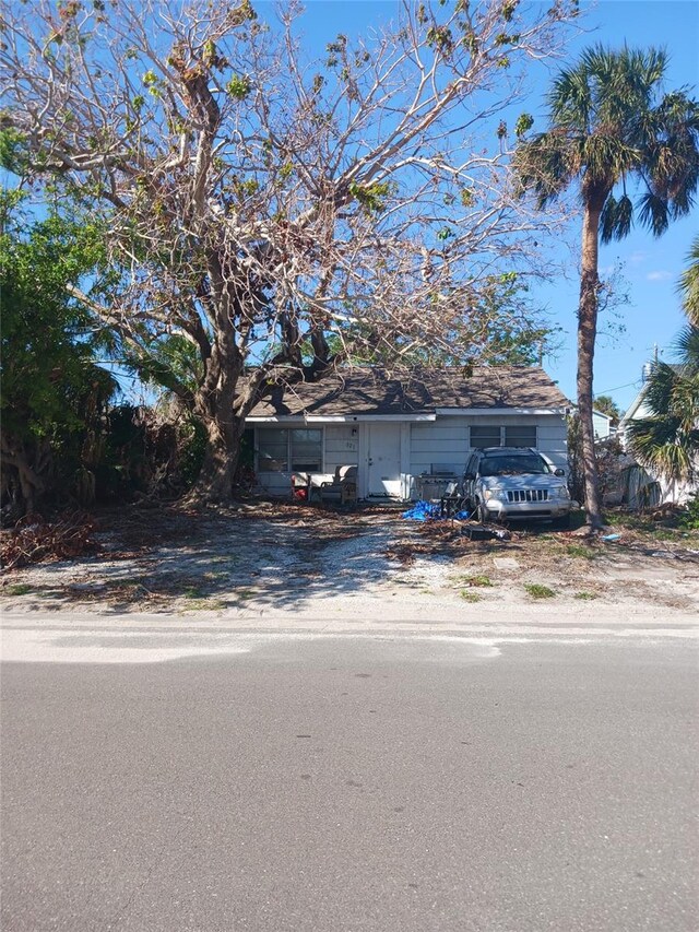 321 77th Ave, St Pete Beach, FL 33706 - view of property hidden behind natural elements with driveway