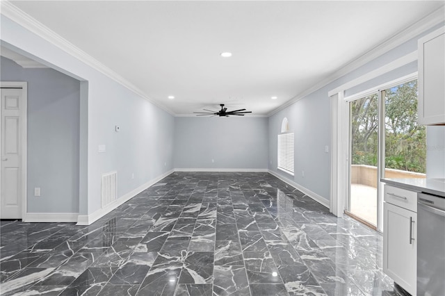 unfurnished room featuring ceiling fan and ornamental molding