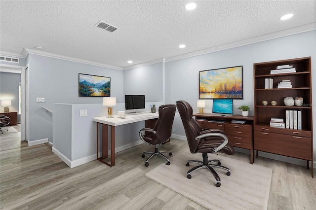 home office with a textured ceiling, light hardwood / wood-style flooring, and ornamental molding