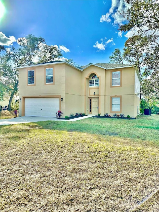 front of property featuring a front yard and a garage