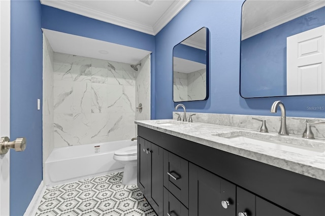 full bathroom with crown molding, vanity, tiled shower / bath combo, and toilet