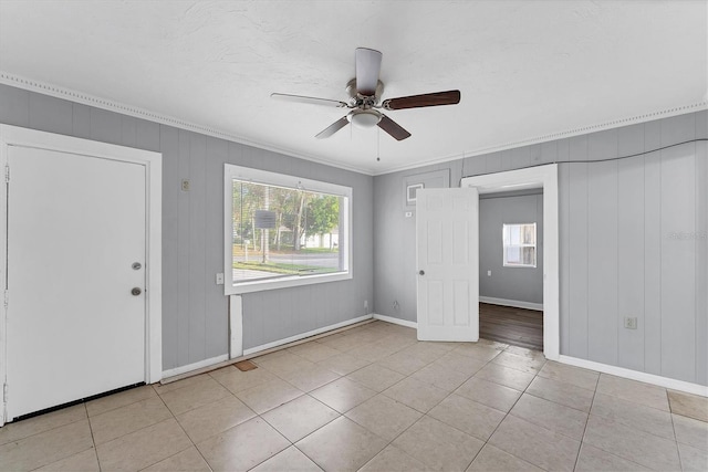 interior space with plenty of natural light, ceiling fan, and light tile patterned floors