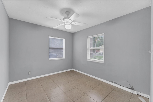 unfurnished room featuring ceiling fan and light tile patterned flooring