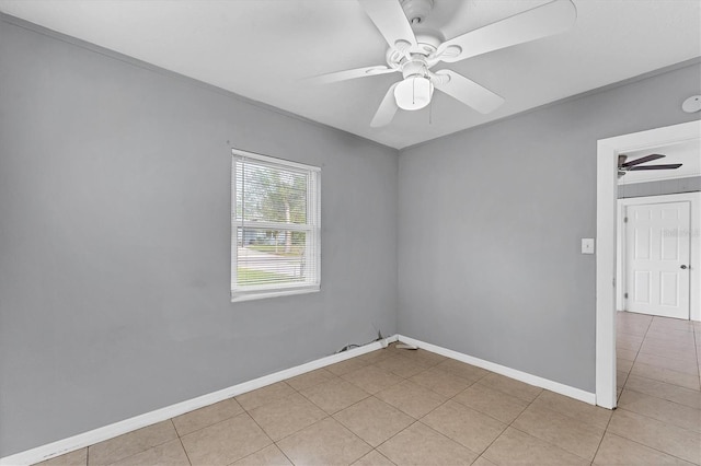 unfurnished room with ceiling fan and light tile patterned flooring