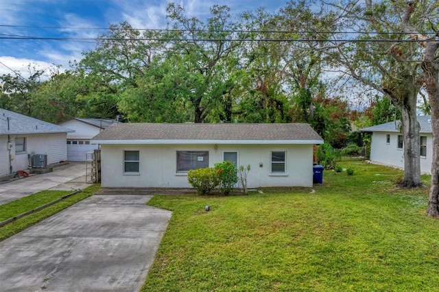 single story home featuring a garage, a front lawn, and central air condition unit