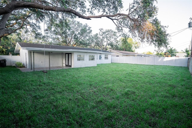 back of property featuring a lawn