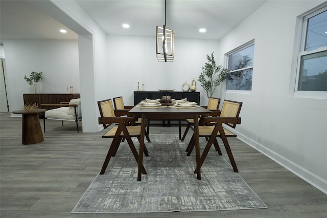 dining space with dark wood-type flooring