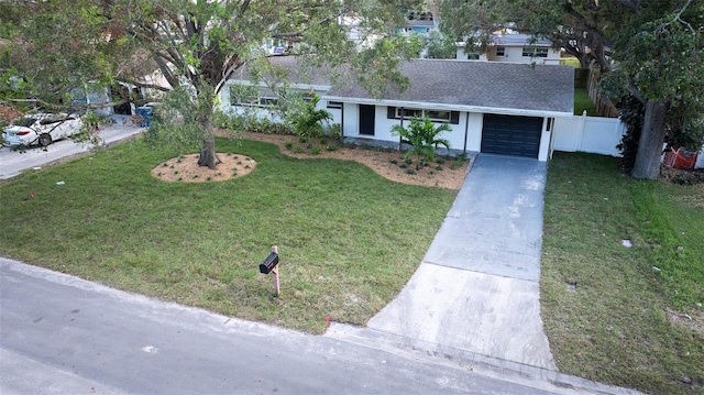 single story home featuring a front yard and a garage