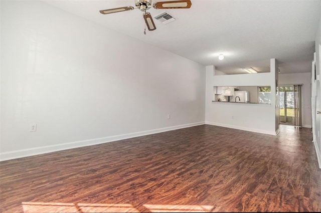 unfurnished living room with ceiling fan, dark hardwood / wood-style flooring, and lofted ceiling