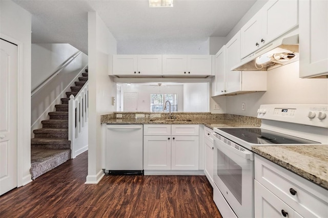 kitchen with dark hardwood / wood-style floors, white cabinetry, white appliances, and sink