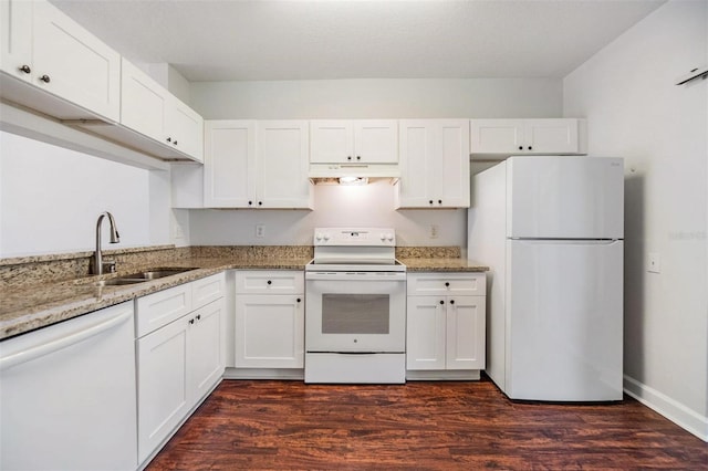 kitchen featuring white cabinets, white appliances, and dark hardwood / wood-style floors