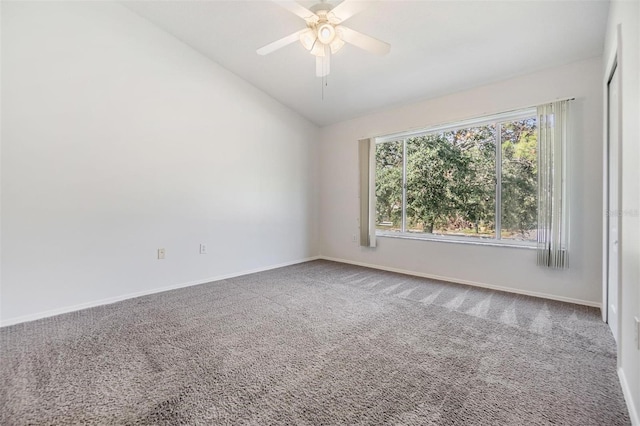 unfurnished room with carpet flooring, ceiling fan, and lofted ceiling