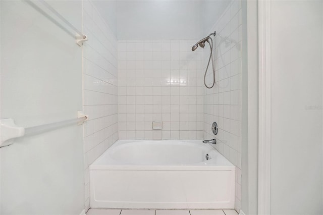 bathroom with tiled shower / bath combo and tile patterned floors