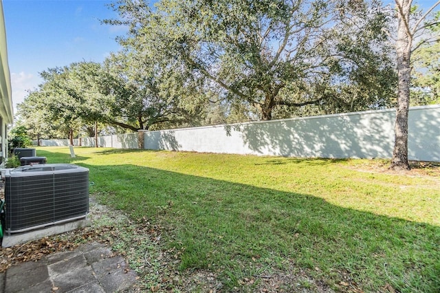 view of yard featuring central AC unit