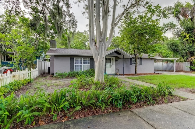 ranch-style home with a front yard